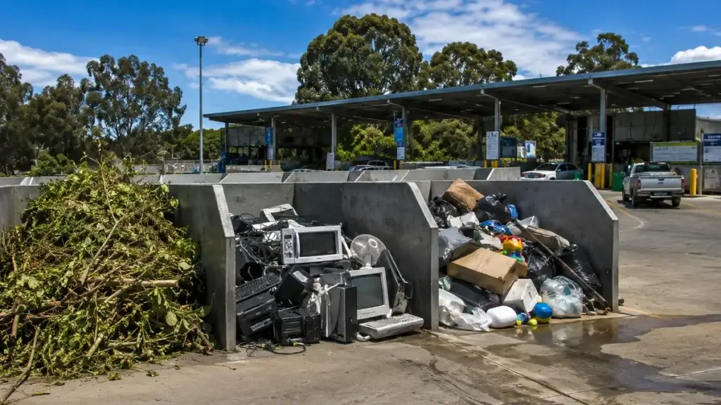 Outdoor waste facility in Melbourne with bays for green waste, e-waste, and general rubbish on a sunny day