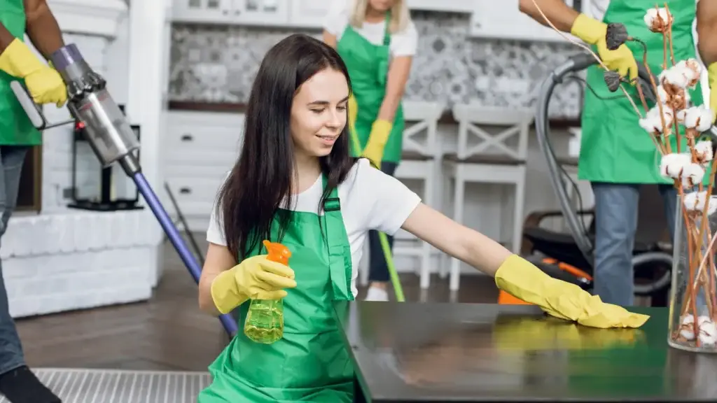 Professional cleaning team working through a residential property during a bond clean