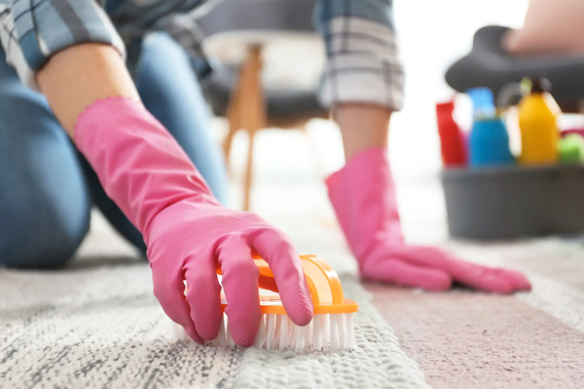 An Urgent Pro carpet cleaning provider in Brisbane positioning high-velocity air movers on freshly cleaned carpet to speed drying, with professional equipment visible in a realistic local service setting
