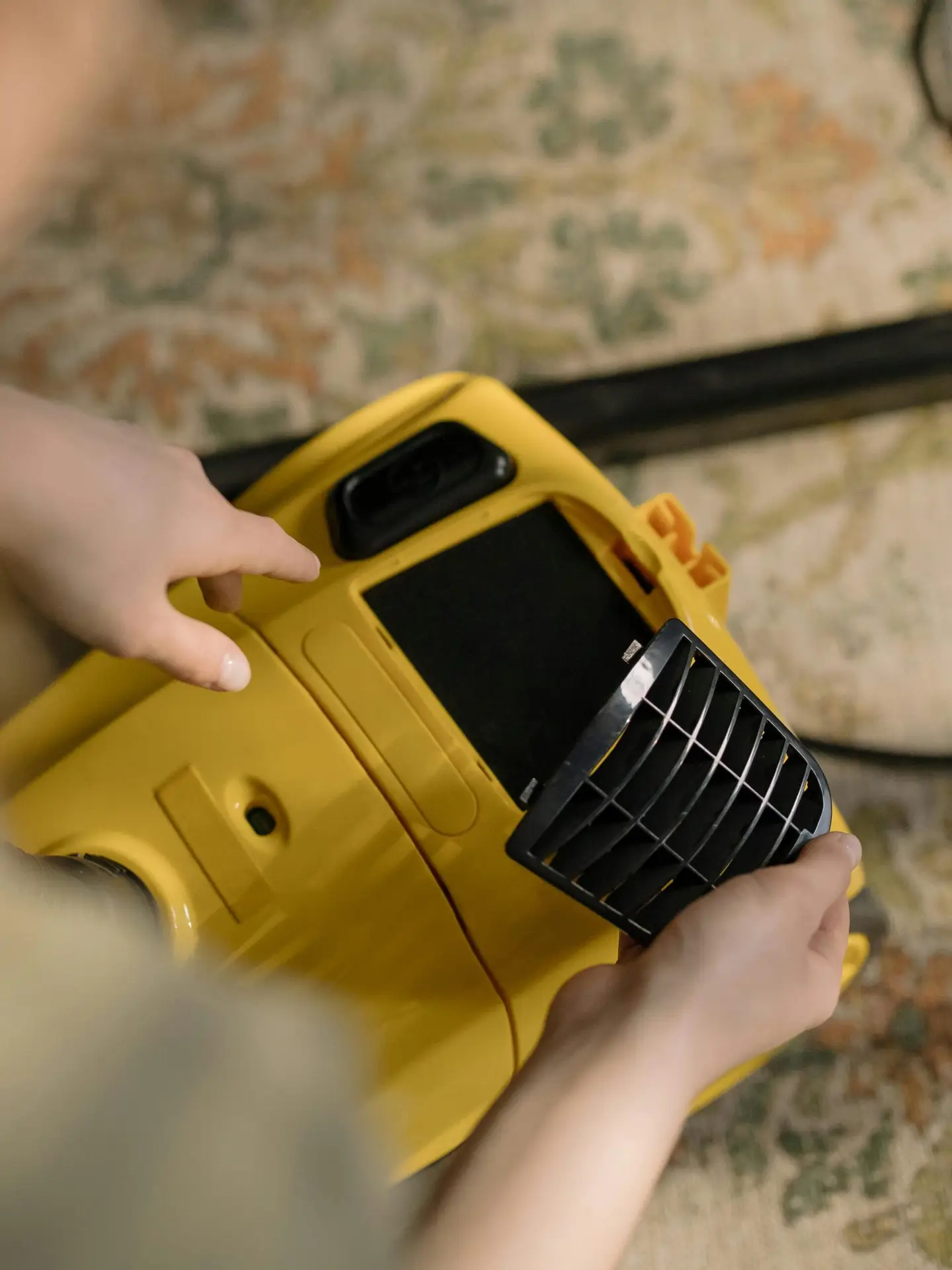 An Urgent Pro carpet cleaning provider in Brisbane operating a hot water extraction machine across a carpeted living room, with professional equipment visible in a realistic local service setting