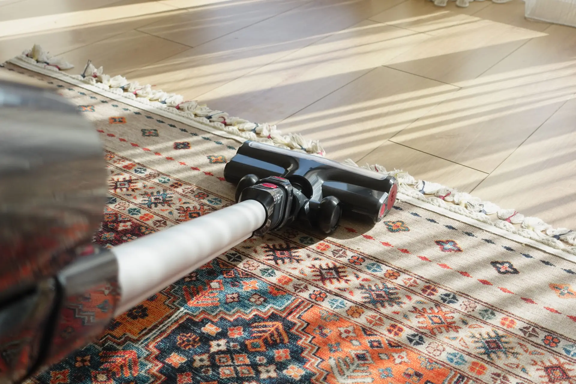 An Urgent Pro carpet cleaning provider in Gold Coast positioning high-velocity air movers on freshly cleaned carpet to speed drying, with professional equipment visible in a realistic local service setting