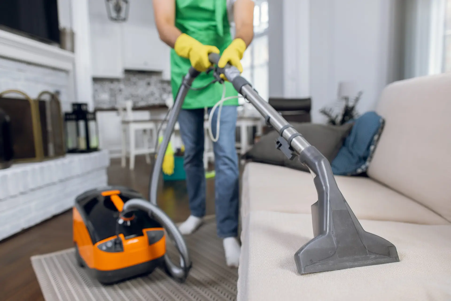 An Urgent Pro carpet cleaning provider in Sydney setting up truck-mount extraction equipment including hoses and the machine head, with professional equipment visible in a realistic local service setting