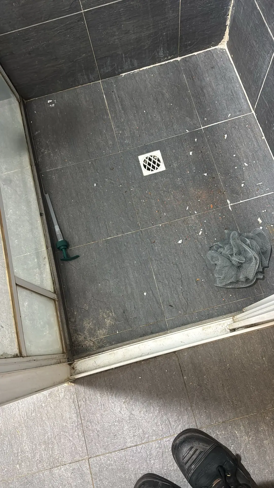 Dirty bathroom floor tiles before bond cleaning, Perth