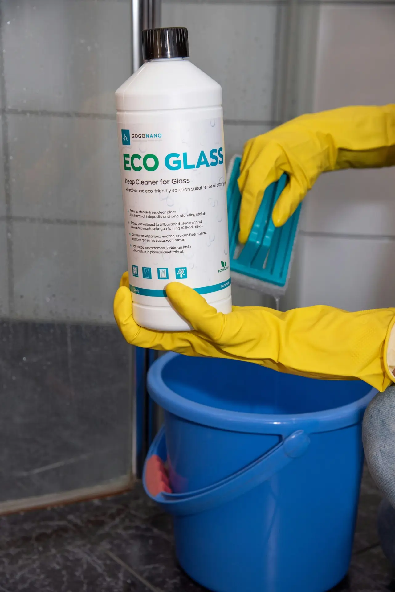 An Urgent Pro end of lease cleaning provider in Perth cleaning the toilet, shower screen, vanity and tiles in a Perth rental bathroom to meet the property manager's inspection standard, with professional equipment visible in a realistic local service setting