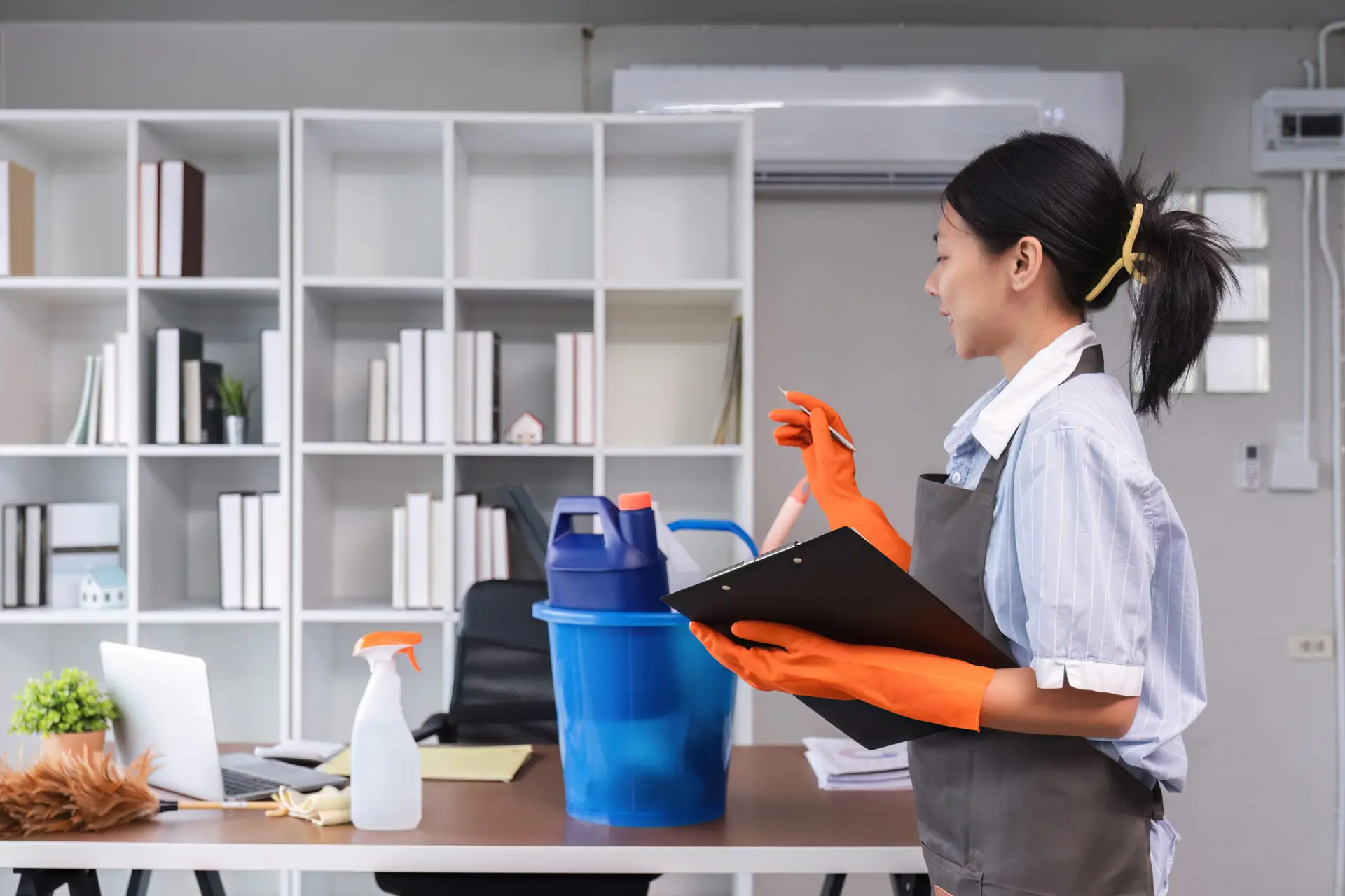 An Urgent Pro end of lease cleaning provider in Perth reviewing a completed end of lease checklist at a Perth rental property with documentation for the bond return, with professional equipment visible in a realistic local service setting