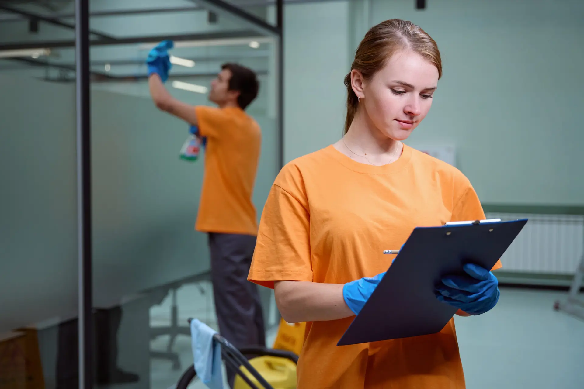 An Urgent Pro end of lease cleaning provider in Sydney reviewing a room-by-room bond cleaning checklist inside a spotless Sydney apartment before the real estate agent arrives, with professional equipment visible in a realistic local service setting