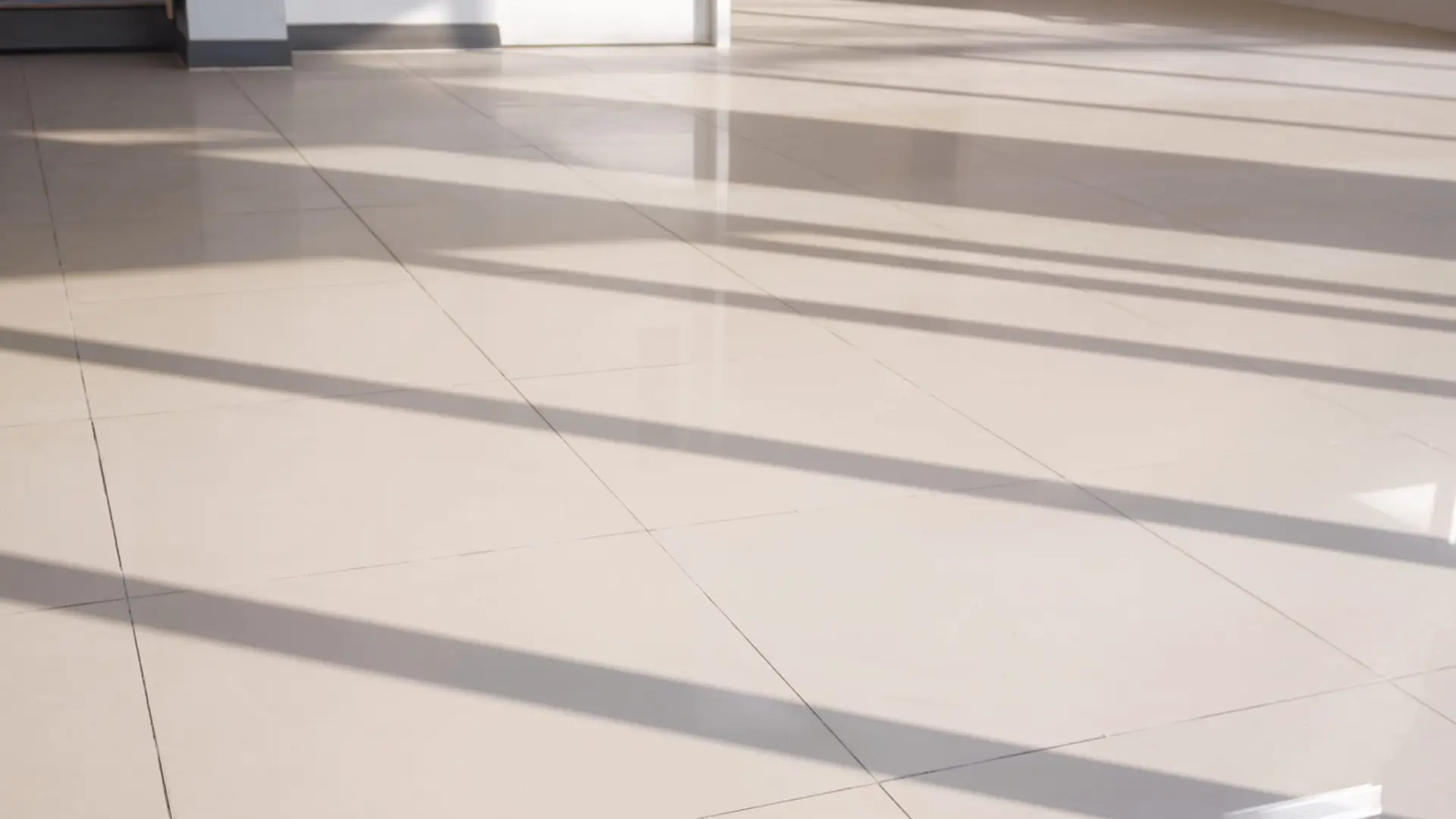 An Urgent Pro house cleaning provider in Brisbane wiping the dining table, cleaning the stovetop and tidying benchtops during a weekly Brisbane house clean, with professional equipment visible in a realistic local service setting