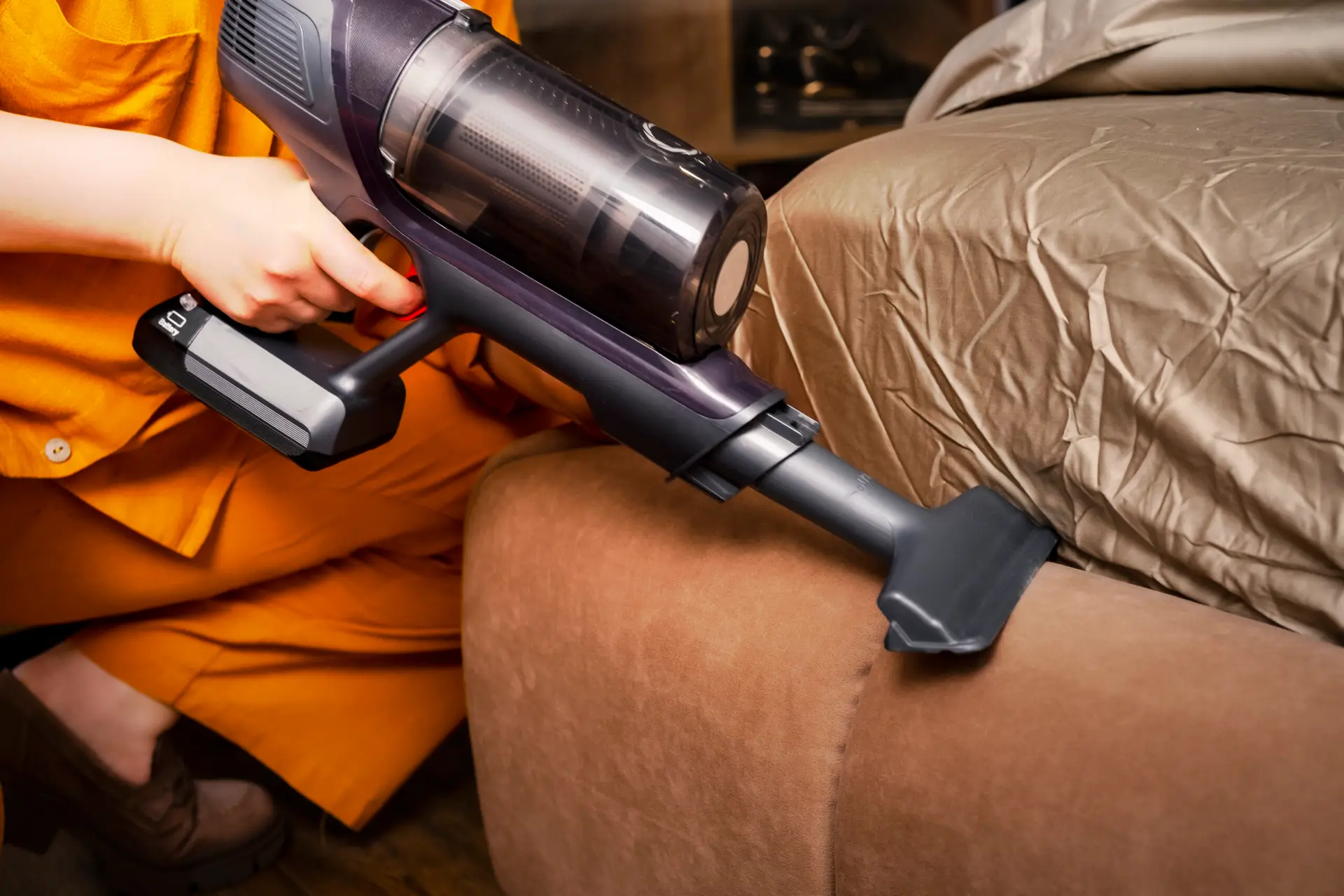An Urgent Pro house cleaning provider in Melbourne vacuuming the bedroom floor, dusting the bedside table and wiping window sills in a Melbourne home bedroom, with professional equipment visible in a realistic local service setting