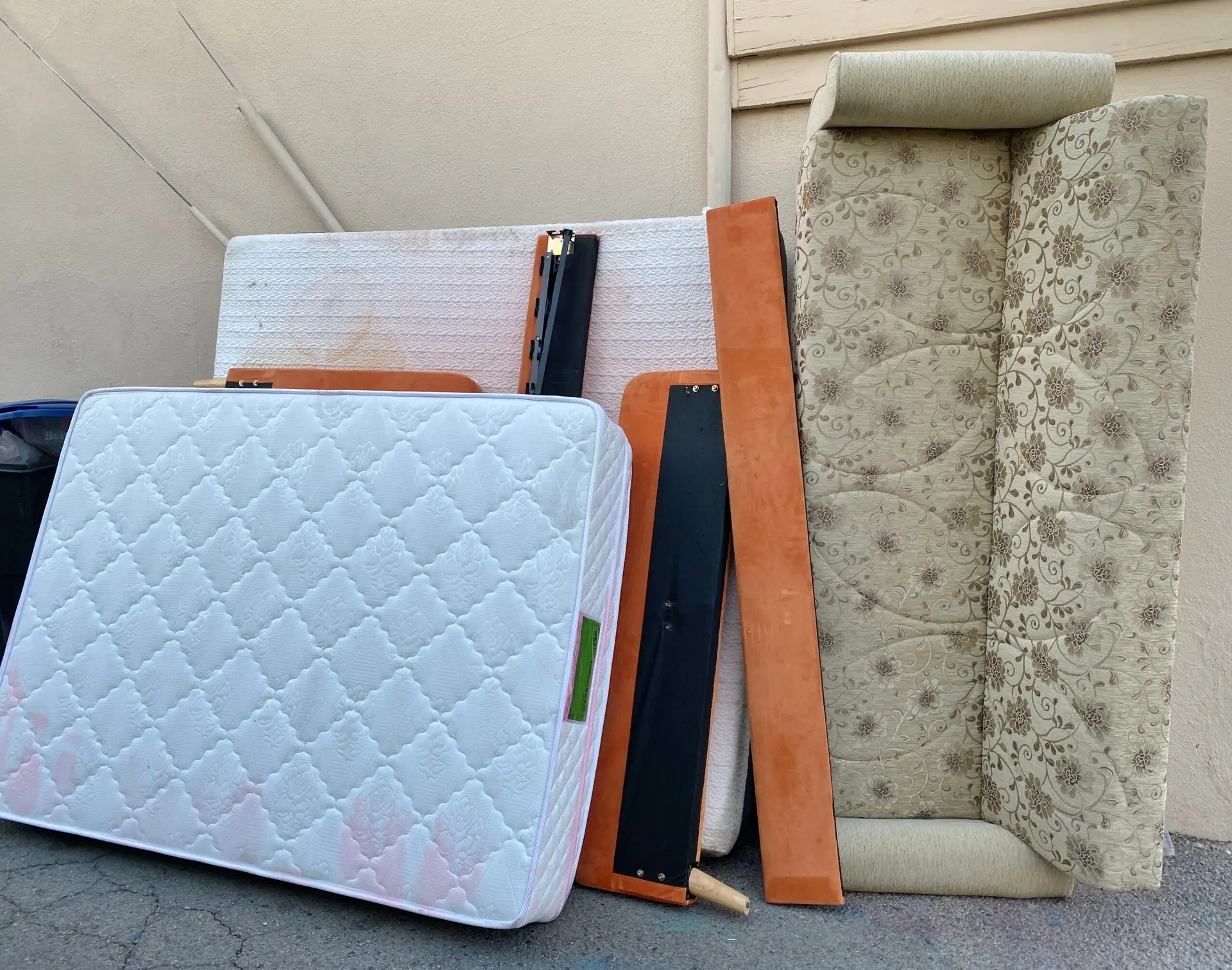 An Urgent Pro rubbish removal provider in Melbourne removing an old sofa, armchair and table from a property for disposal and responsible recycling, with professional equipment visible in a realistic local service setting