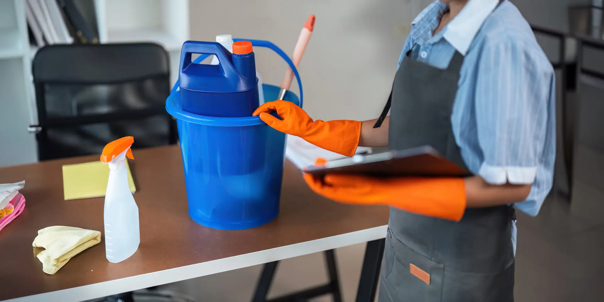 An Urgent Pro team member reviewing a printed cleaning checklist at the entry of a spotless Melbourne rental home, ticking completed rooms and confirming the property is ready before the real estate agent arrives